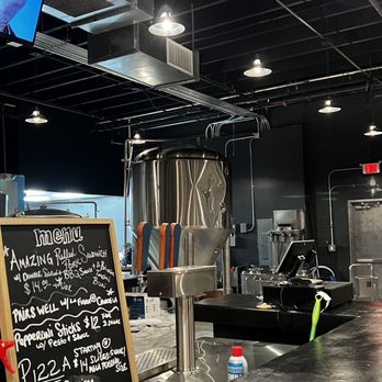 Black Flamingo - a man in a suit and tie standing in front of a beer tank - Breweries Near Me - Oakland Park, Florida Black Flamingo - a man in a suit and tie standing in front of a beer tank - Breweries Near Me - Oakland Park, Florida