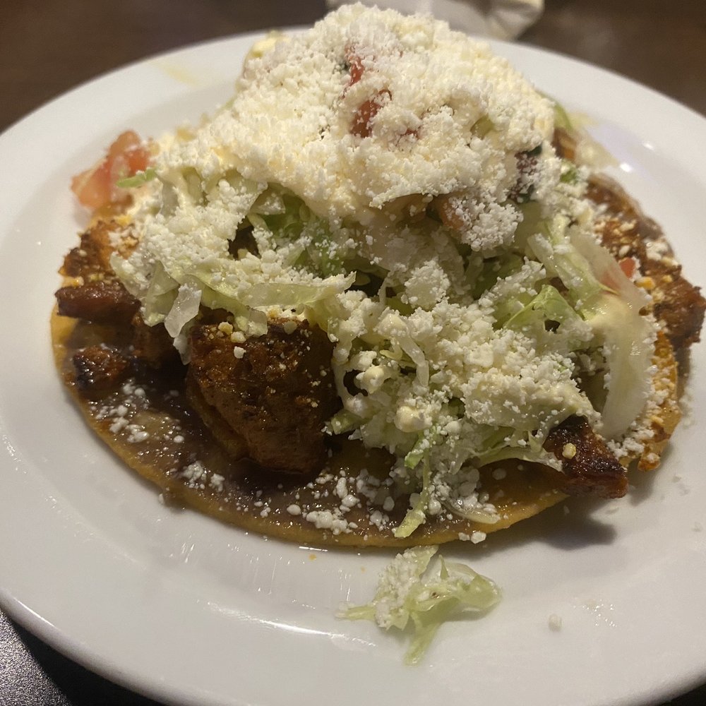 La Papa Loca - a plate of food on a table - Honduran Near Me - Lafayette, Louisiana La Papa Loca - a plate of food on a table - Honduran Near Me - Lafayette, Louisiana