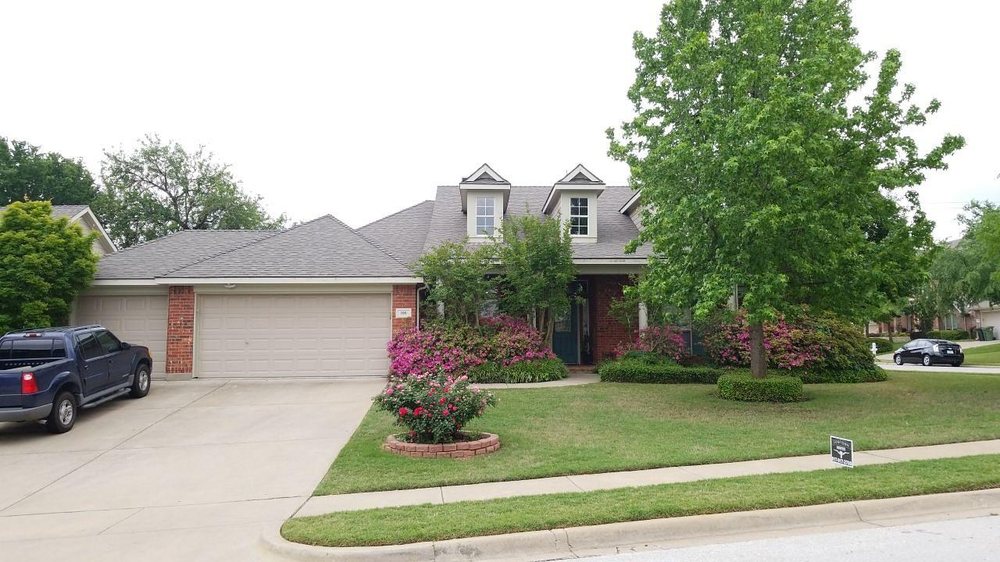 Slide of Cowtown Roofing