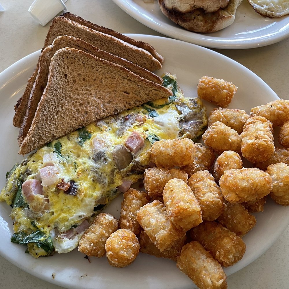 Sunset Grill - Omelette (Spinach, Ham, Mushrooms) with Tater Tots instead of home fries and Wheat - American Near Me - Ithaca, New York Sunset Grill - Omelette (Spinach, Ham, Mushrooms) with Tater Tots instead of home fries and Wheat - American Near Me - Ithaca, New York
