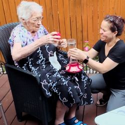 Care 4 All - Setting up hummingbird feeders.