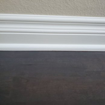AM Pro Painting - Baseboards and shoe molding repainted...without taping the newly refinished floor. So impressive!!! - Painters Near Me