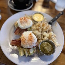 Seven Mile Cafe - The California Benny - Bacon, avocado, grilled tomatoes and two poached eggs over a toasted biscuit served with hollandaise sauce.