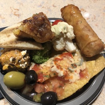 Universal Studios Florida - Buffet on the RIP tour.Veggies, hummus, meats and cheeses, grilled cheese, corn, olives, egg rolls, chips w queso and salsa - Amusement Parks Near Me - Orlando, Florida