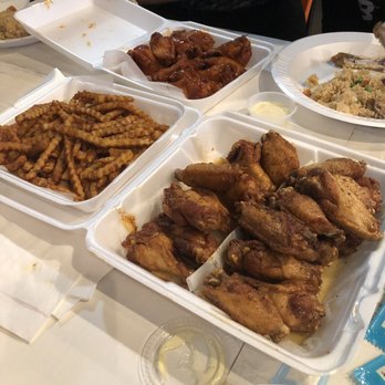 Chimac - Mild, honey Cajun, and honey garlic wings with fries and fried rice. - Chicken Wings Near Me - Houston, Texas Chimac - Mild, honey Cajun, and honey garlic wings with fries and fried rice. - Chicken Wings Near Me - Houston, Texas