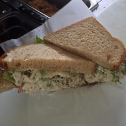 Curb Your Appetite - I'm known for my Chicken Salad.... This is a Chicken salad on wHoney Wheat with lettuce Tim sprouts snd avacado