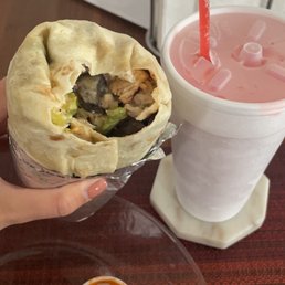 Firecracker chicken burrito with Diablo sauce and a "house red" slush Firecracker chicken burrito with Diablo sauce and a "house red" slush