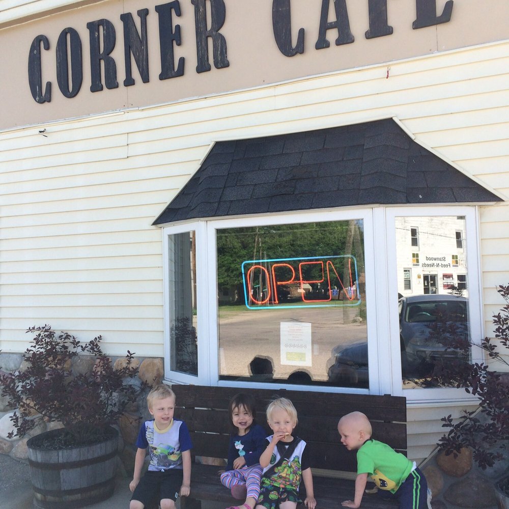 Corner Cafe - three children sitting on a bench - Cafes Near Me - Stanwood, Michigan