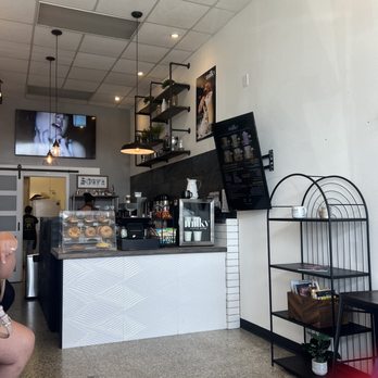 Milky Coffee Bar - a woman sitting at a counter - Coffee & Tea Near Me - Corpus Christi, Texas