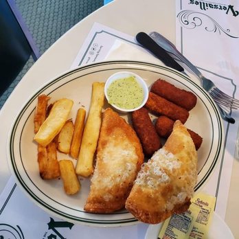 Versailles - Sampler.. Empanadas, Croquettes and some type of potatoes (Yuca I think they called them) - Cuban Near Me - Miami, Florida Versailles - Sampler.. Empanadas, Croquettes and some type of potatoes (Yuca I think they called them) - Cuban Near Me - Miami, Florida