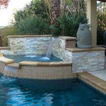 Open Water Pools and Spas - a pool with a waterfall - General Contractors Near Me Open Water Pools and Spas - a pool with a waterfall - General Contractors Near Me