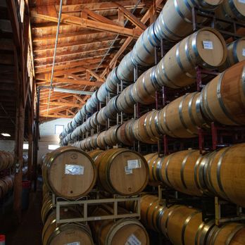 Pallet Wine Company - rows of barrels in a wine cellar - Wineries Near Me - Medford, Oregon Pallet Wine Company - rows of barrels in a wine cellar - Wineries Near Me - Medford, Oregon