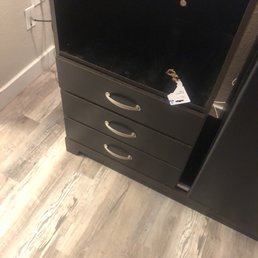 Trash on the dresser and tv stand.