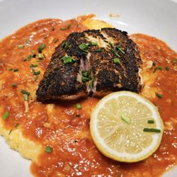 Celeste Coastal Cuisine - BLACKENED RED FISH blue crab etouffee - gouda - stone ground grit. Very good!