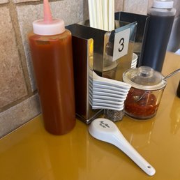 condiments and a spoon condiments and a spoon