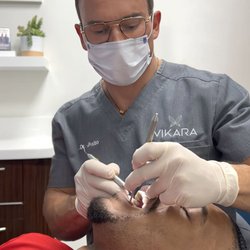 Biscayne Dental & Facial Aesthetics - Dr Julio perfecting a smile
