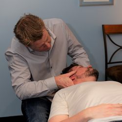 Performance Chiropractic & Rehabilitation - Dr. Brian helping a patient with neck pain