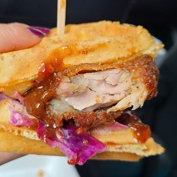 The Dirty Bird Chicken + Waffles - a person holding a sandwich - Chicken Shop Near Me - Toronto, Ontario The Dirty Bird Chicken + Waffles - a person holding a sandwich - Chicken Shop Near Me - Toronto, Ontario