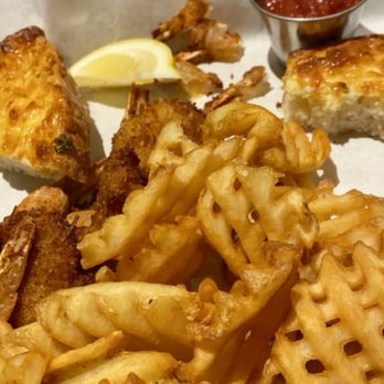 Shore Grille - Coconut shrimp, waffle fries, and cheesy bread (partially eaten since it smelled and tasted so good) - American Near Me - San Pedro, California Shore Grille - Coconut shrimp, waffle fries, and cheesy bread (partially eaten since it smelled and tasted so good) - American Near Me - San Pedro, California