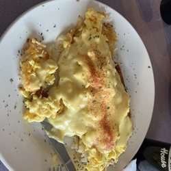 Dalles Cafe and Coffee House - Special of the day: hash browns topped with bacon crumbles, scrambled egg, cheese, and hollandaise sauce! Delicious!