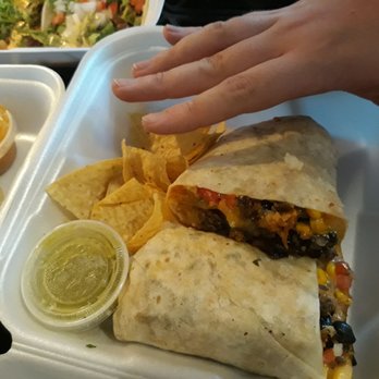 Taco Shop - Look how big the Burrito Asada is. That's the hand of my 6'4" son. - Tacos Near Me - Reno, Nevada Taco Shop - Look how big the Burrito Asada is. That's the hand of my 6'4" son. - Tacos Near Me - Reno, Nevada