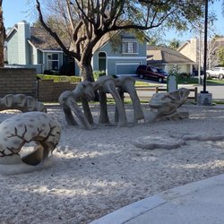 Mayfair Park - Dinosaur sand box: Bring your sand toys and a brush for "excavating" bones.