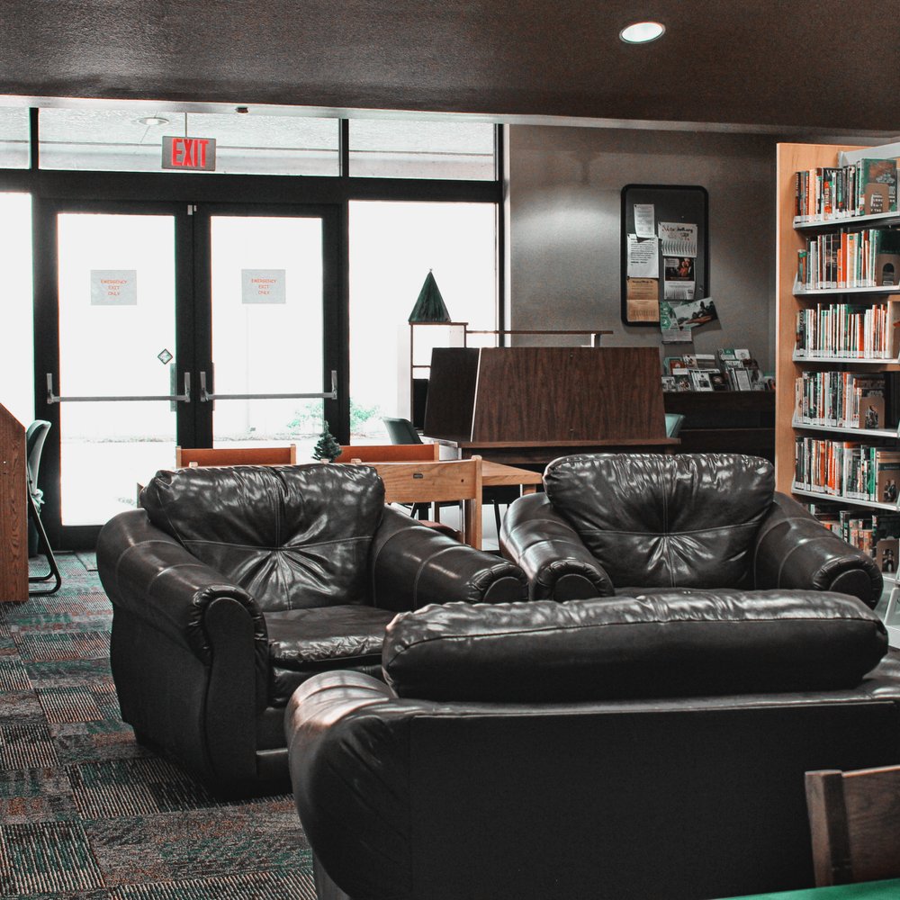 DeSoto County Library - Reading area and comfy chairs, with personal desks (plus outlets) in the background. - Libraries Near Me - Arcadia, Florida DeSoto County Library - Reading area and comfy chairs, with personal desks (plus outlets) in the background. - Libraries Near Me - Arcadia, Florida