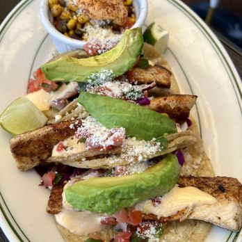 The Dock at Crayton Cove - Blackened mahi tacos. The corn side dish is everything. Put it on your tacos! - Seafood Near Me - Naples, Florida The Dock at Crayton Cove - Blackened mahi tacos. The corn side dish is everything. Put it on your tacos! - Seafood Near Me - Naples, Florida