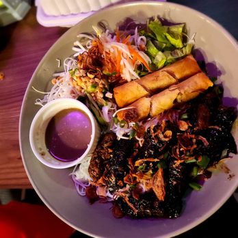 Magnolia Pho - a plate of food on a table - Vietnamese Near Me - Seattle, Washington