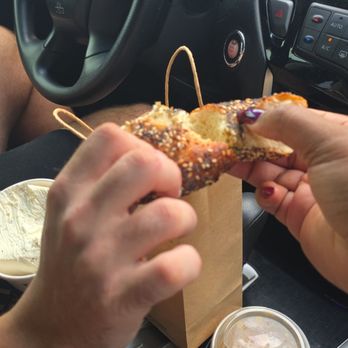 PopUp Bagels - Splitting the everything bagel - Bagels Near Me - Winter Park, Florida PopUp Bagels - Splitting the everything bagel - Bagels Near Me - Winter Park, Florida