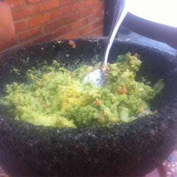 Añejo Restaurant - Guacamole post table side mixing. - Mexican Near Me - Calgary, Alberta