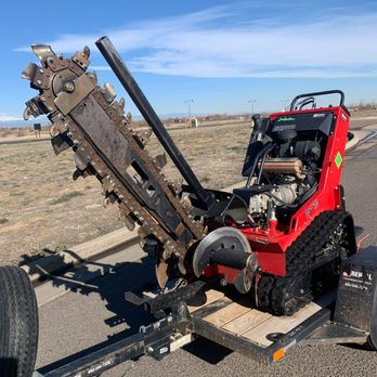 My LA Landscaping - the front end of a tractor being towed on a trailer - Landscaping Near Me - Brighton, Colorado My LA Landscaping - the front end of a tractor being towed on a trailer - Landscaping Near Me - Brighton, Colorado