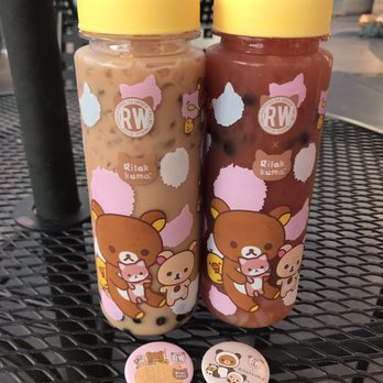 Roasting Water - Left: black milk tea w/ boba, right: red dawn tea with lychee jelly  Ft. Cute limited edition rilakkuma pins - Bubble Tea Near Me - Long Beach, California
