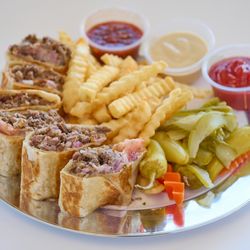 One Stop Gyros & Burritos - Beef shawarma thinly sliced marinated and cooked traditionally on a vertical rotisserie