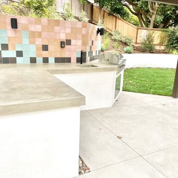 Brookside Landscape Design - Tile backsplash and tile detailing around grass - Landscaping Near Me