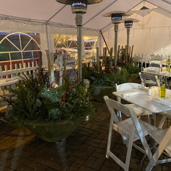Mario's Table - a patio with tables and chairs - Italian Near Me - Chicago, Illinois Mario's Table - a patio with tables and chairs - Italian Near Me - Chicago, Illinois