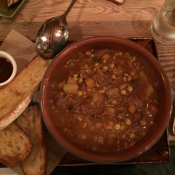 Lechon - Locro stew - brisket, chorizo, corn, potatoes - Tapas Bars Near Me - Portland, Oregon Lechon - Locro stew - brisket, chorizo, corn, potatoes - Tapas Bars Near Me - Portland, Oregon