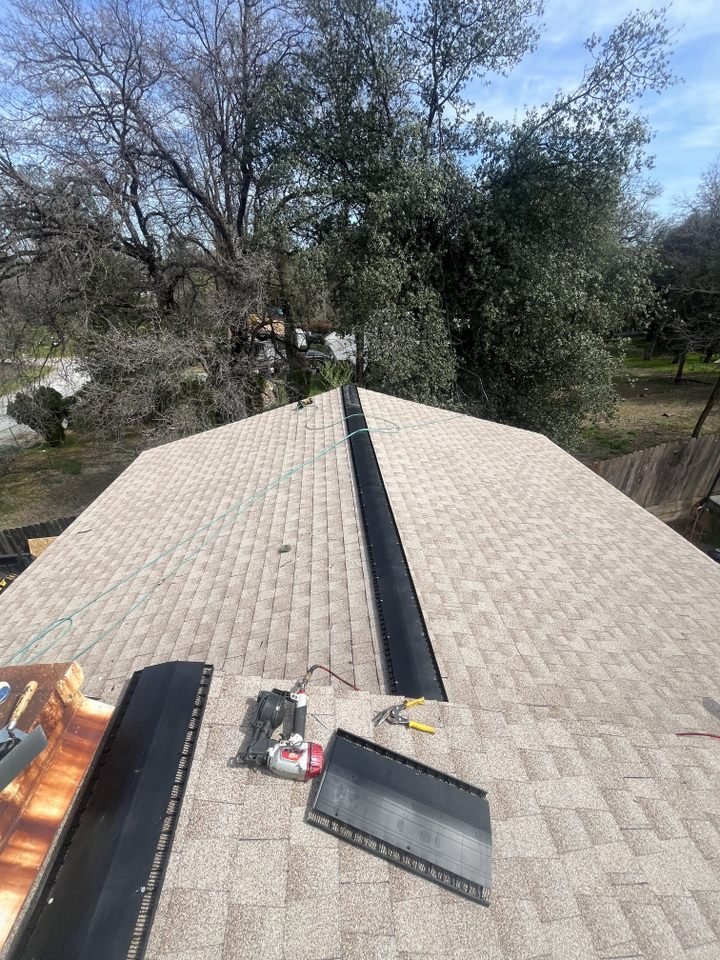 Slide of Tugwell Roofing