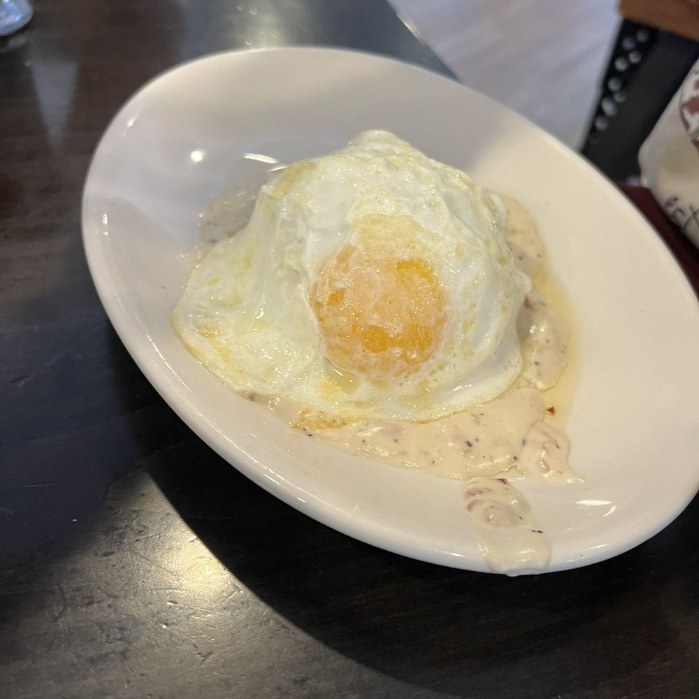 Nosh - Biscuits and gravy with over easy egg - New American Near Me - Geneva, Illinois Nosh - Biscuits and gravy with over easy egg - New American Near Me - Geneva, Illinois