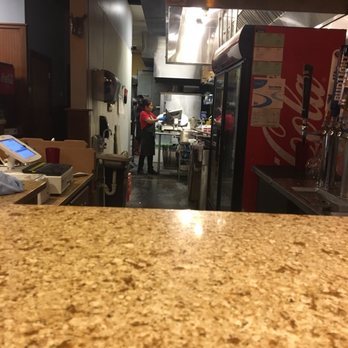 Riverboat Pizza - She's shredding fresh mozzarella.... this place is legit - Pizza Near Me - Savannah, Georgia