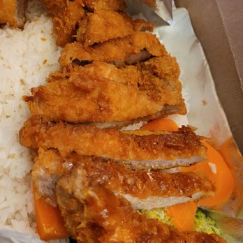 Marathon Cafe - Close up of the pork chop over rice. - Chicken Wings Near Me - Little Neck, New York