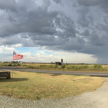 Sod House - Looking out from the museum property to the road and ominous clouds - Museums Near Me - Aline, Oklahoma