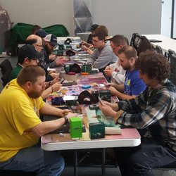 MAD Bros Games & Hobbies - Some guys gaming in the back half of the shop