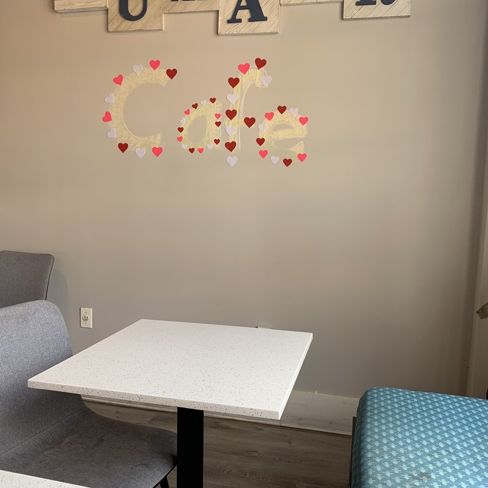 a table and chairs in a small room