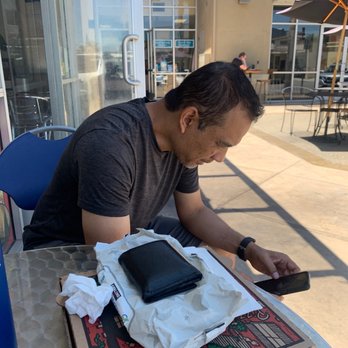 LW Pizza - Youthea eating 4 slices of pizza - Pizza Near Me - Long Beach, California