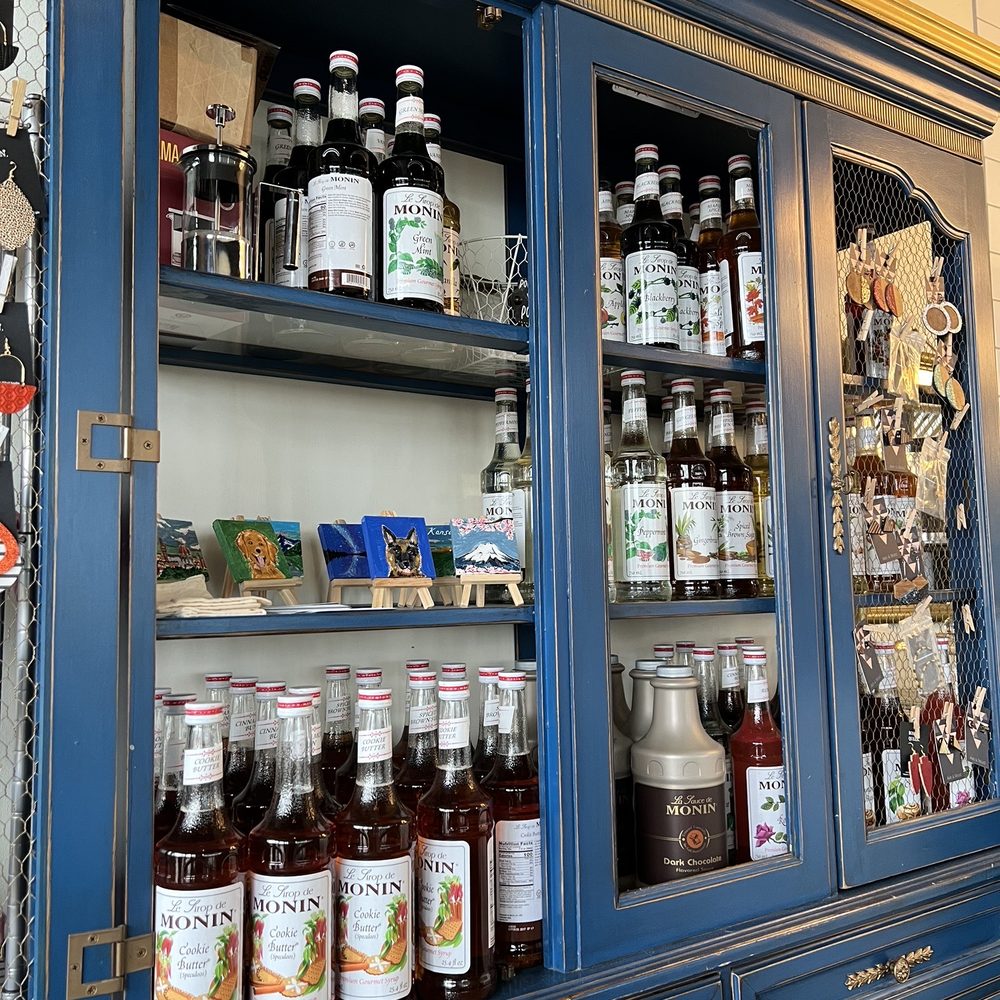 Pour Coffeehouse - a blue china cabinet filled with drinks - Coffee & Tea Near Me - Olathe, Kansas Pour Coffeehouse - a blue china cabinet filled with drinks - Coffee & Tea Near Me - Olathe, Kansas