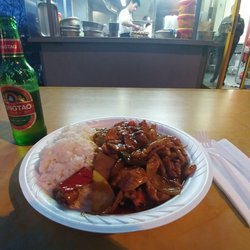 China Fast & Good - 15 Franc for the meal (pork in sate sauce) including rice. 3 Franc for the beer.