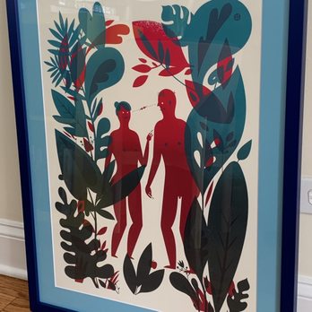 All Right Sales - A framed illustration shows two stylized human figures surrounded by large, colorful leaves and foliage, with a reflective glass surface. - Framing Near Me - Chicago, Illinois