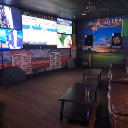 Mulligans Sports Pub - Tvs, games, and couches