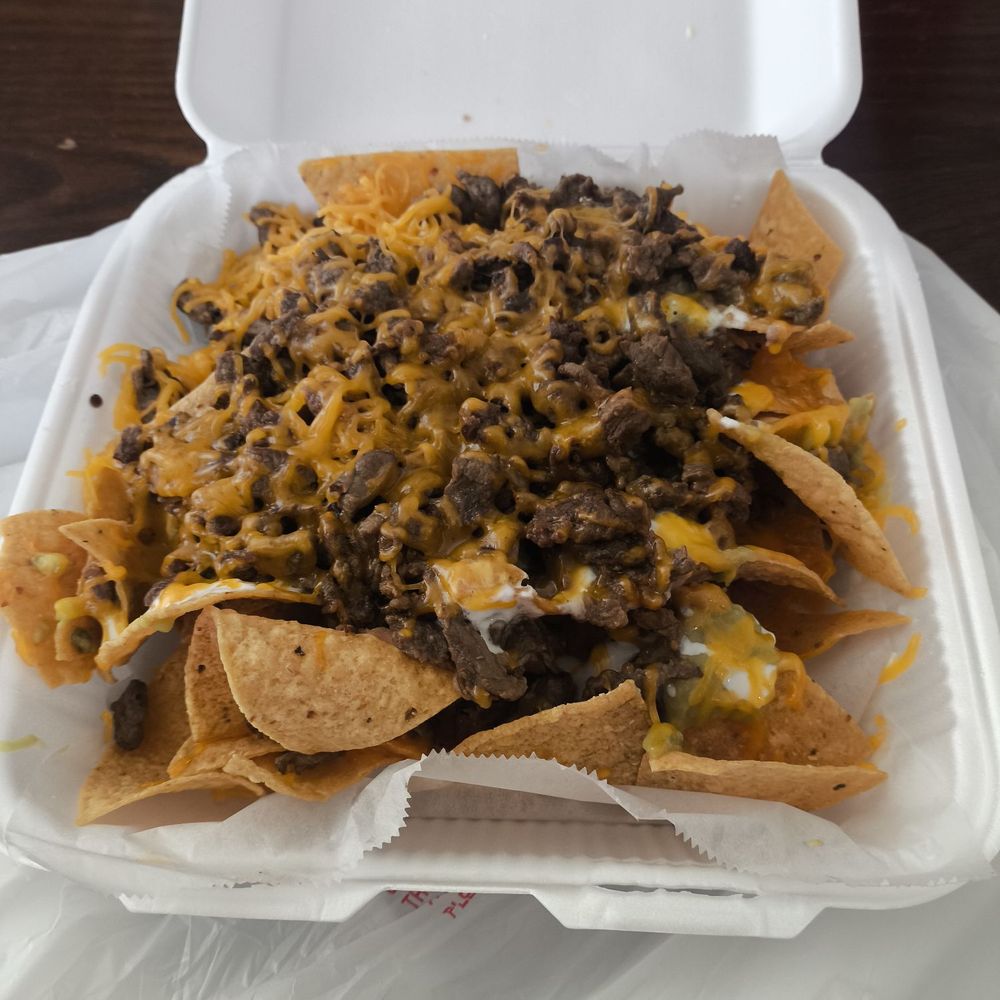 Super delicious nachos but lacking size/abundant toppings, guacamole, sour cream, beans and cheese Super delicious nachos but lacking size/abundant toppings, guacamole, sour cream, beans and cheese